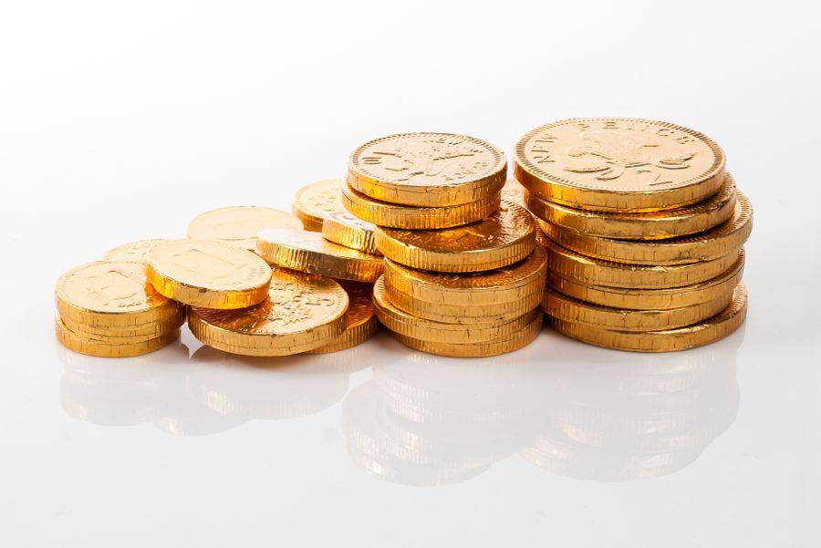 Koin emas sebagai ilustrasi cashback mingguan